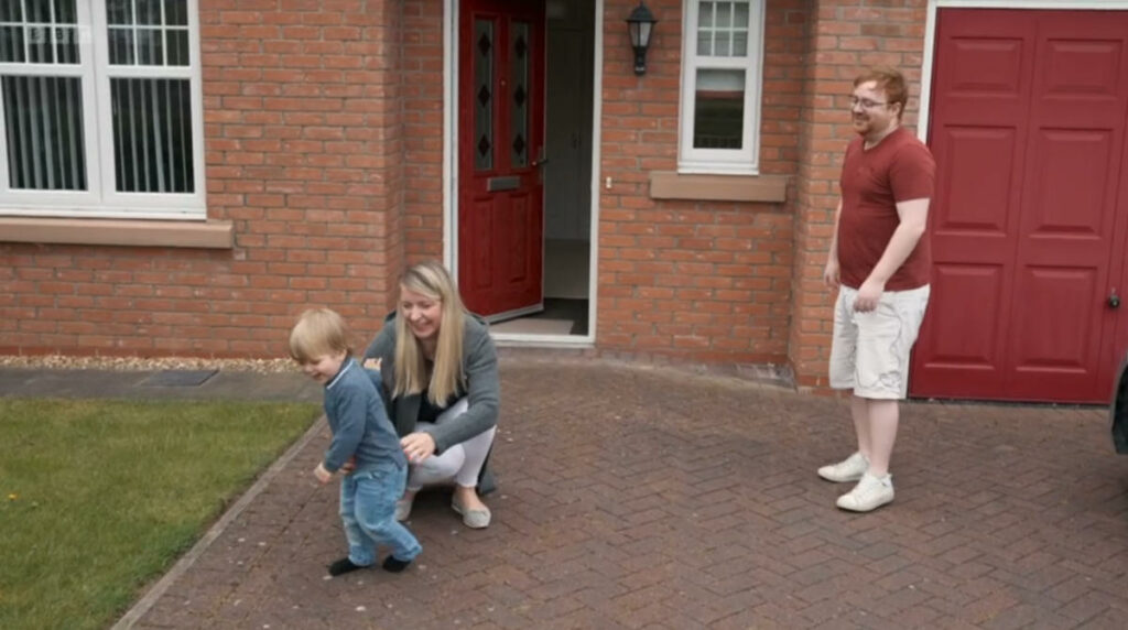 Niall Farrell with family outside his home